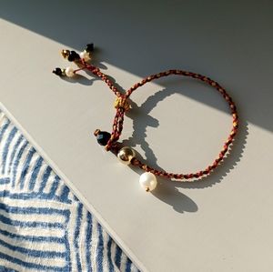 Hand -woven 14 k gold over sterling silver and freshwater pearl bracelet